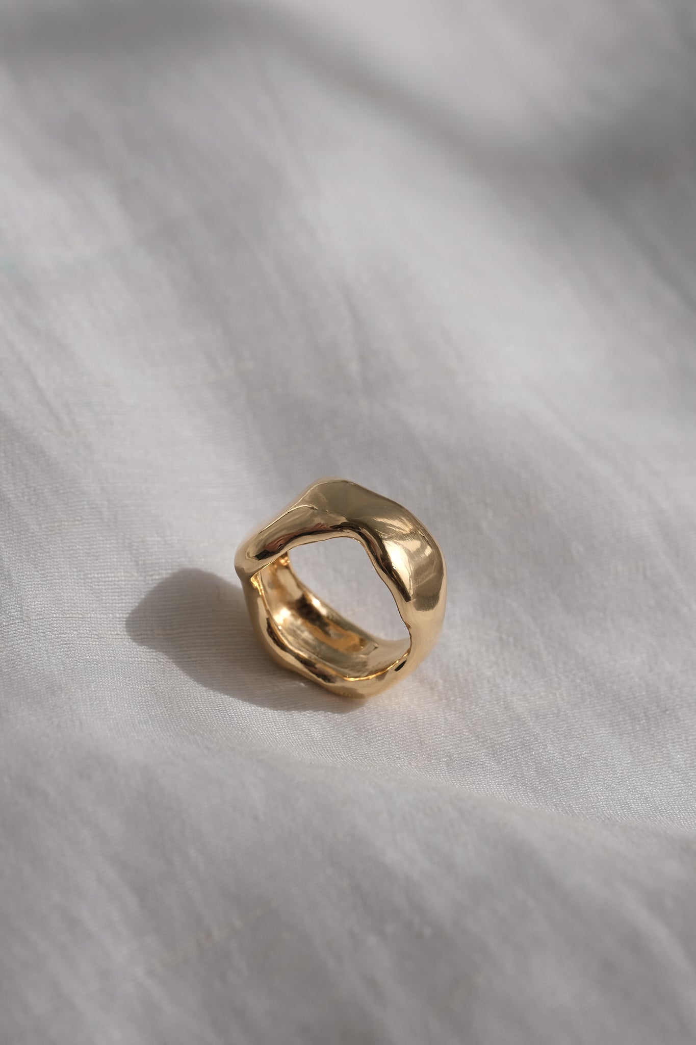 Handmade MOA ring in 18k gold-plated recycled silver, showcasing a natural shiny surface, symbolizing ethical jewelry.