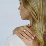 Woman wearing the MOA ring, featuring recycled silver and showcasing ethical handmade jewelry.