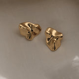 Handmade MOA earrings in 18k gold-plated recycled silver, featuring a unique organic design, showcasing ethical jewelry craftsmanship.