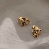 Handmade MOA earrings in 18k gold plating, crafted from recycled materials for sustainable, ethical jewelry.