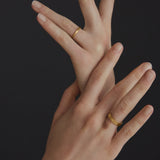 Handmade ISIA small ring in 18k gold-plated brass worn on hands, showcasing ethical and sustainable jewelry.