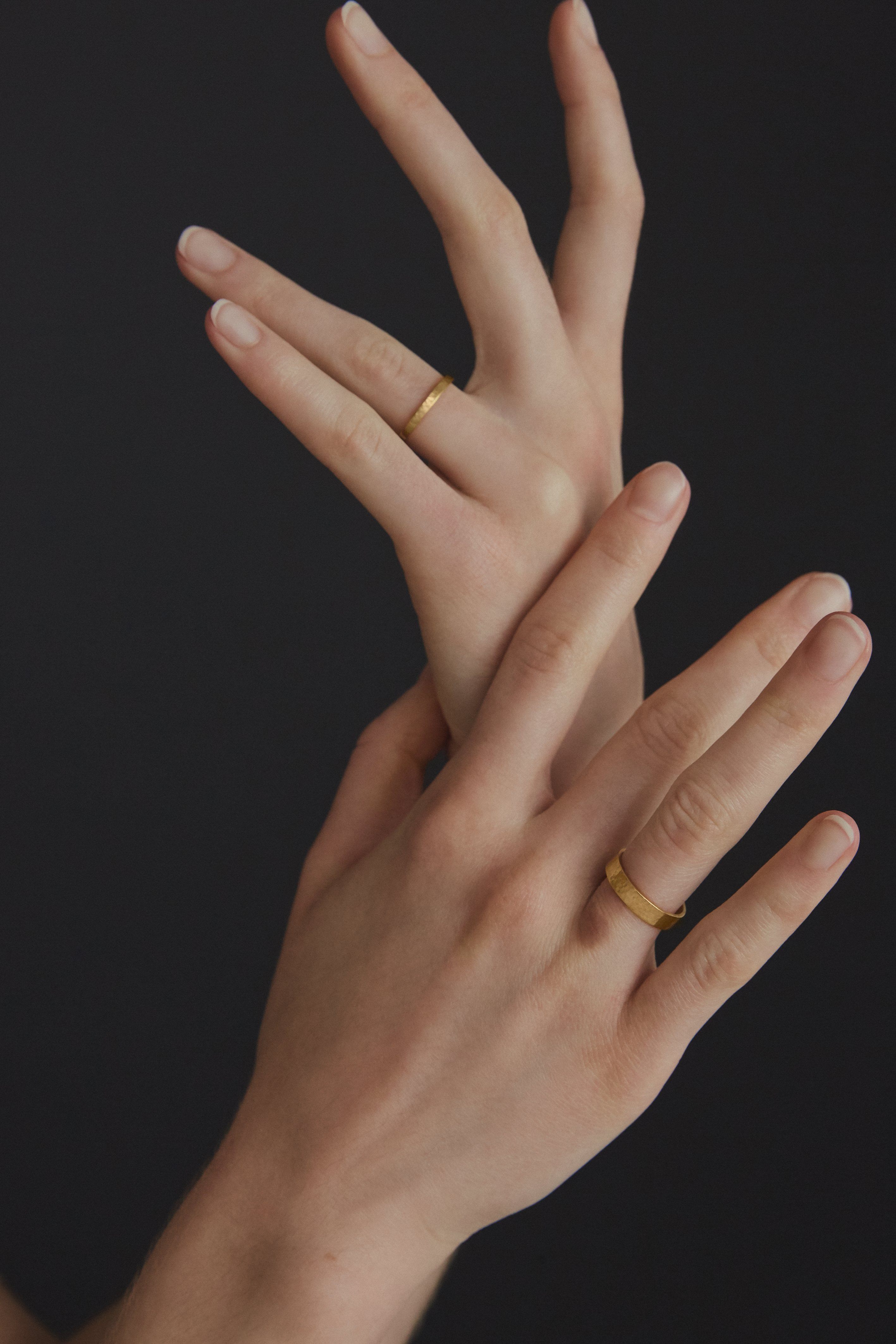 Handmade ISIA small ring in 18k gold-plated brass worn on hands, showcasing ethical and sustainable jewelry.